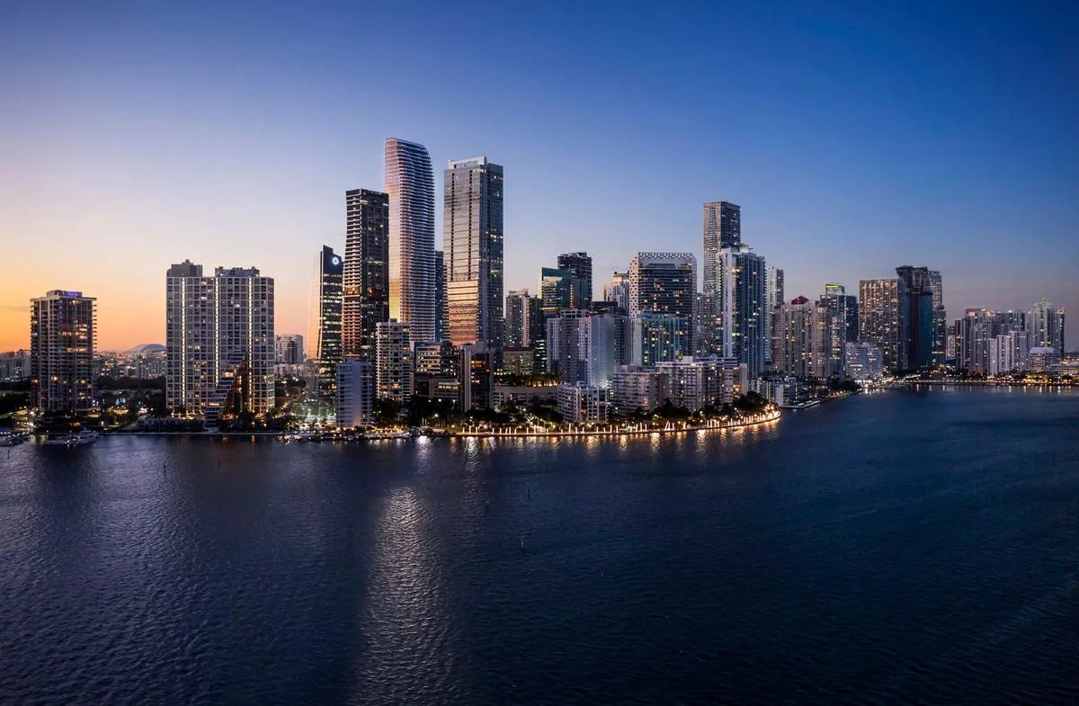 The Brickell, Miami waterfront skyline at dusk featuring The Residences at 1428 Brickell Ave &mdash; artist's conceptual rendering