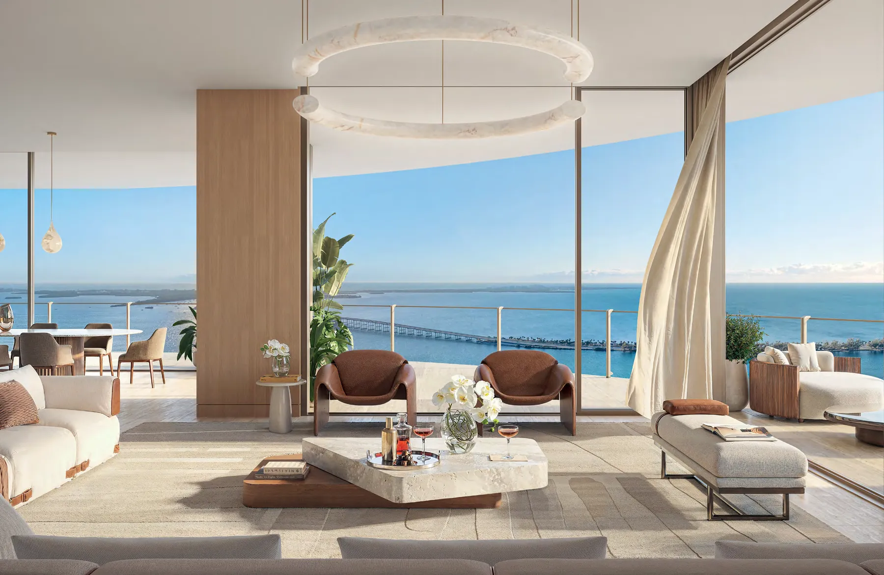 Artist's conceptual rendering of a 619 Brickell residence living room with floor-to-ceiling glass framing Biscayne Bay