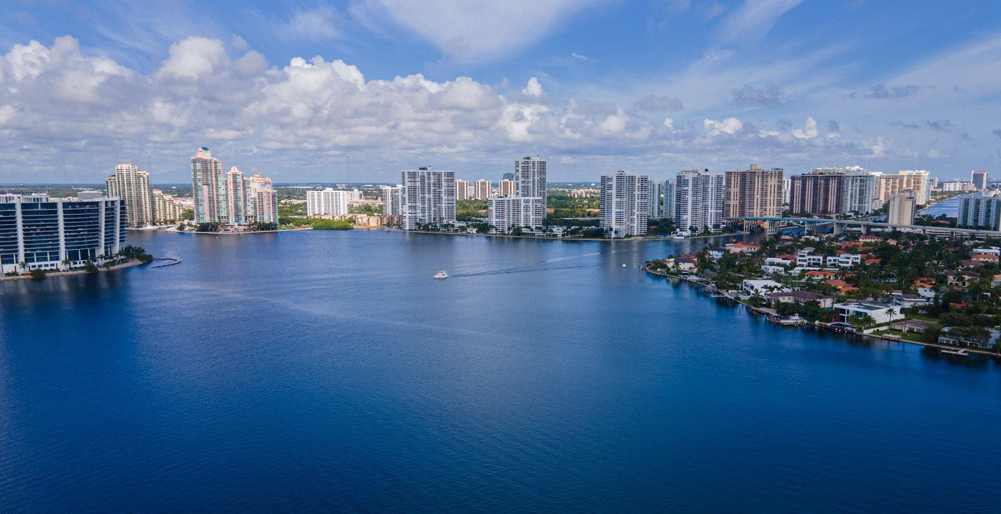 Aerial view of Aventura luxury waterfront condominium towers along the Intracoastal Waterway in Florida