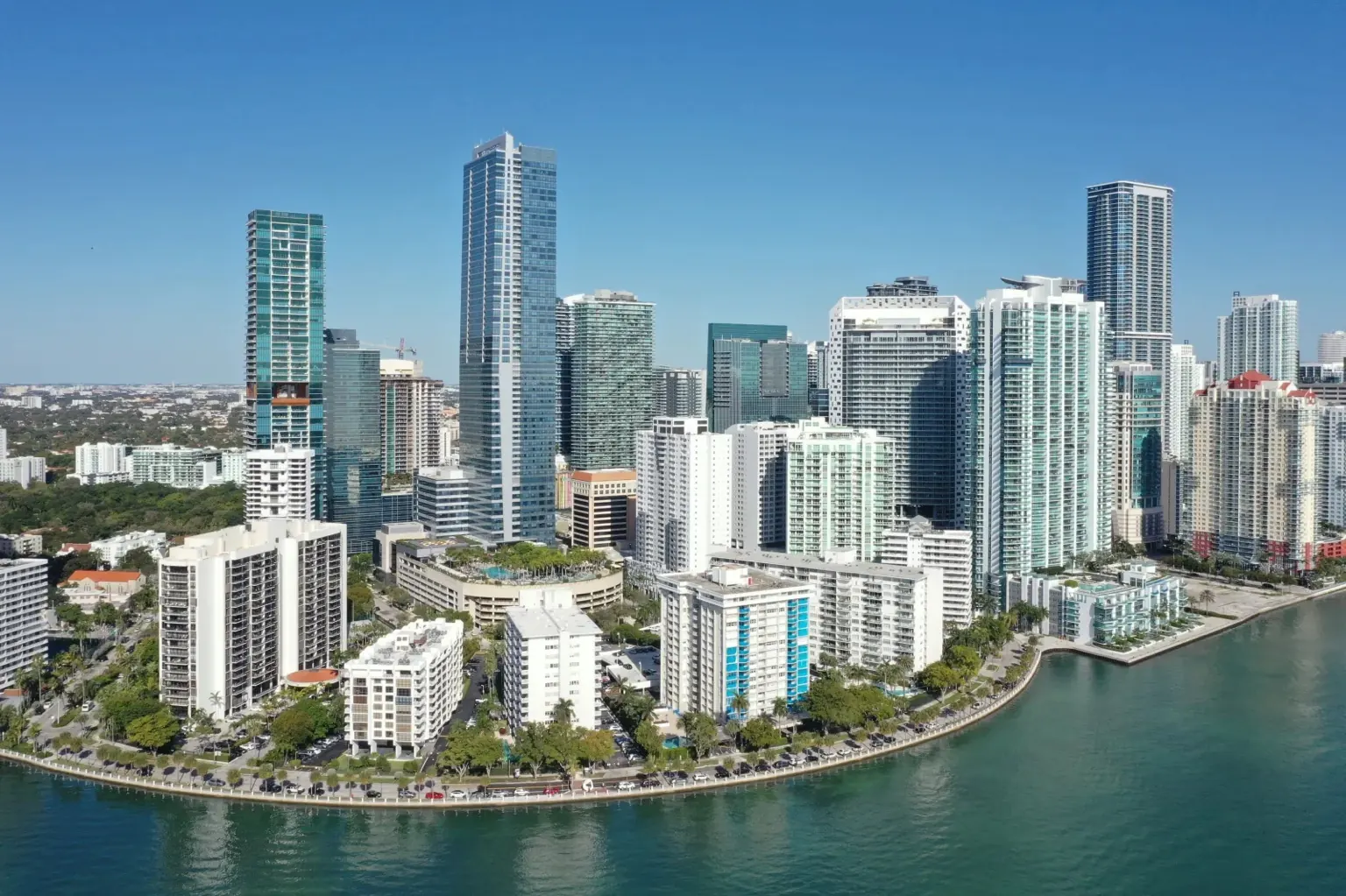Brickell condos for sale skyline view with luxury high-rise towers and Biscayne Bay in Miami