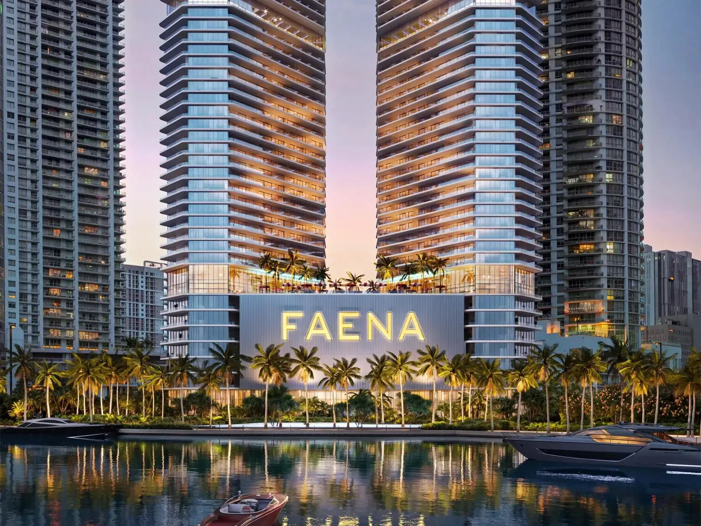 Render artístico de Faena Residences Miami desde el río Miami, con el letrero iluminado de Faena, el paseo ribereño bordeado de palmeras y las dos torres elevándose al fondo.