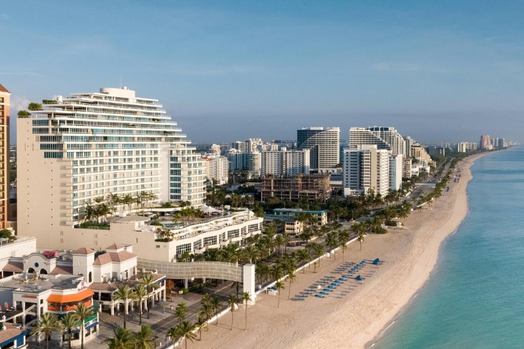 Aerial view of Fort Lauderdale Beach, with oceanfront luxury hotels and condominiums lining the sand along the Atlantic Ocean and A1A