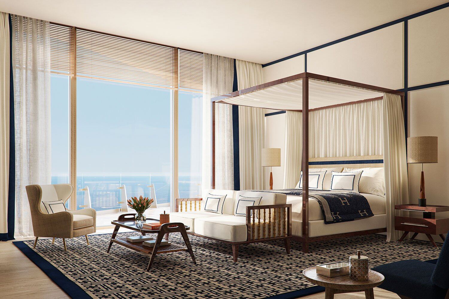 Habitaci&oacute;n principal con cama con dosel y vistas de piso a techo a Biscayne Bay en Four Seasons Private Residences Coconut Grove