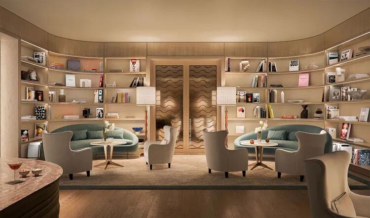Biblioteca lounge para residentes con estanter&iacute;as curvas e interiores de Michele B&ouml;nan en Four Seasons Private Residences Coconut Grove