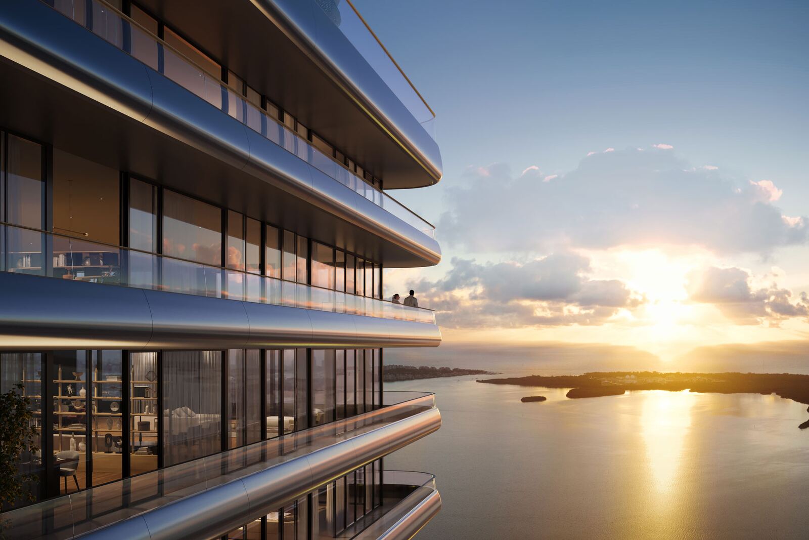 Terrazas curvas de las residencias con vista a Biscayne Bay al atardecer desde Mercedes-Benz Places Miami