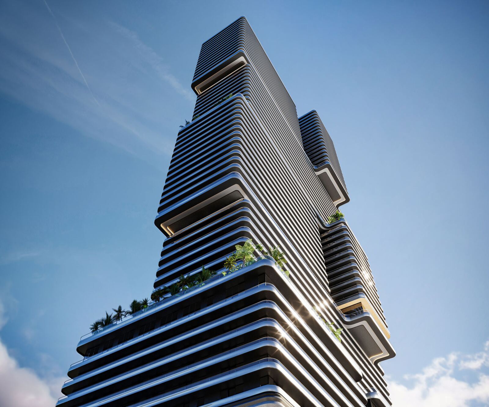 Fachada plateada esculpida de la torre Mercedes-Benz Places Miami con terrazas ajardinadas contra el cielo azul
