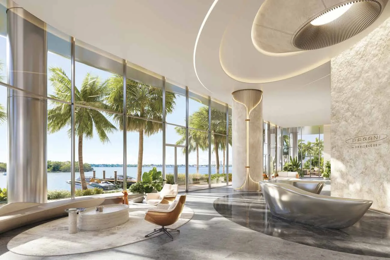 Representación conceptual del artista del lobby frente al agua en Pagani Residences, con vidrio curvo, muro de travertino, asientos escultóricos y vistas a la marina sobre Biscayne Bay