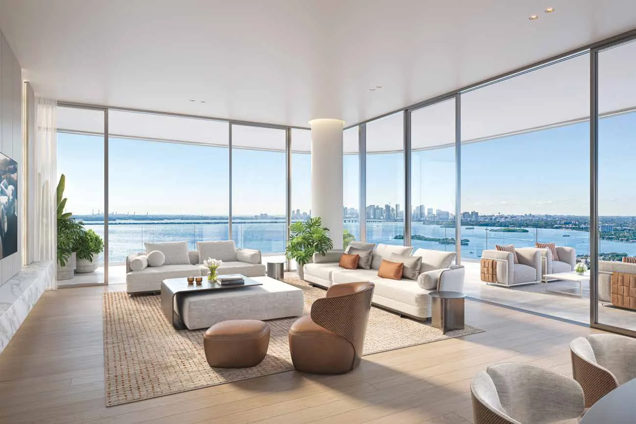Representación conceptual del artista de una sala de esquina en Pagani Residences, con vidrio de piso a techo en dos exposiciones, asientos en cuero y vistas sobre Biscayne Bay hacia el perfil de Miami