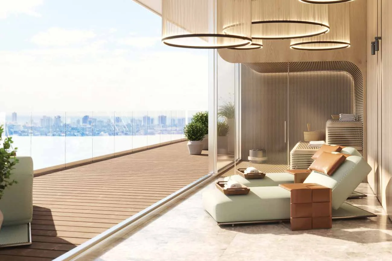 Representación conceptual del artista del nivel Waterfront Wellness en Pagani Residences, con salón de relajación del spa, sauna de madera y terraza abierta sobre Biscayne Bay