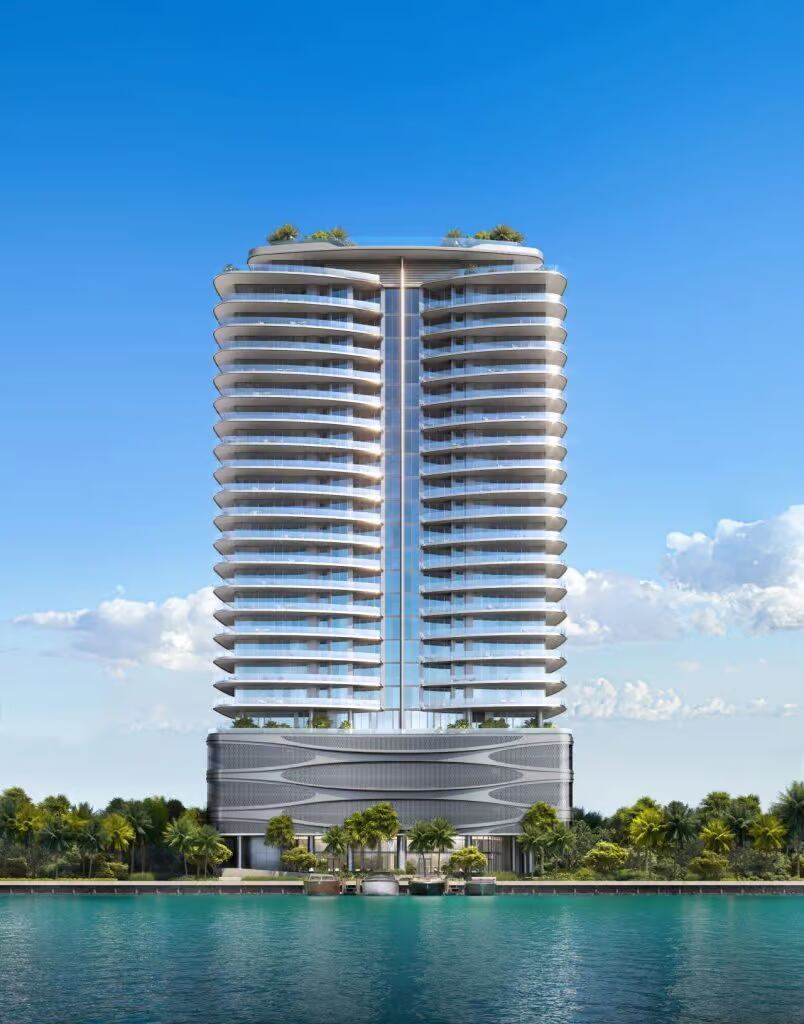 Curved-balcony waterfront tower of Pagani Residences rising over Biscayne Bay on Harbor Island, North Bay Village