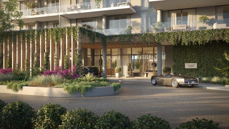 Vine-draped porte-cochere arrival with a classic roadster at Rosewood Residences Hillsboro Beach