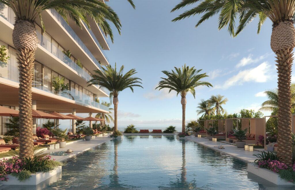 Palm-lined oceanfront pool at sunrise with cabanas facing the Atlantic at Rosewood Residences Hillsboro Beach