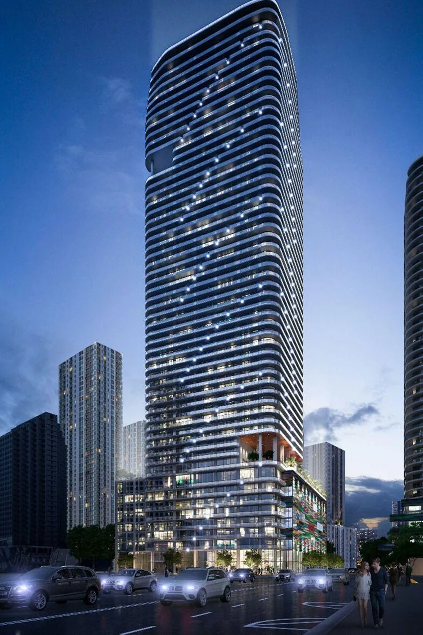 Torre de condominios SLS Lux Brickell con podio iluminado en Brickell Miami