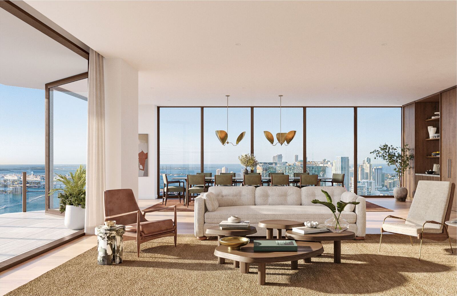 Sala y comedor por Vicky Charles con vistas de piso a techo a Biscayne Bay y el skyline de Miami en Villa Miami
